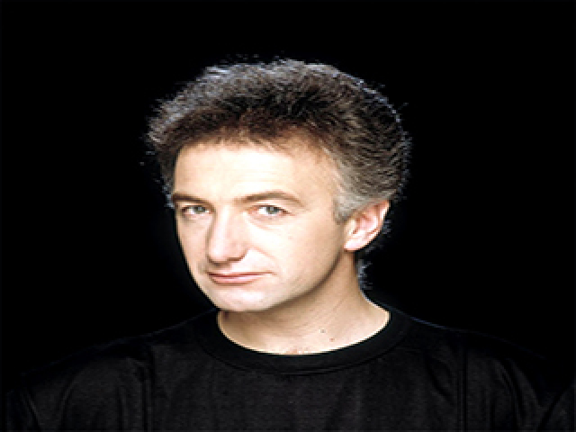 John Deacon. E a inspiração veio da filha mais nova dele que costumava dizer: "I want it all and I want it now" (Eu quero tudo e eu quero agora)