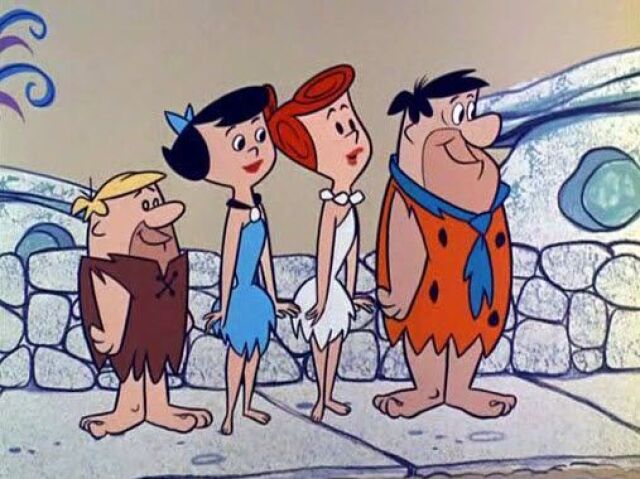 Nossa! Eu iria pro mundo dos Flintstones, óbvio! :)