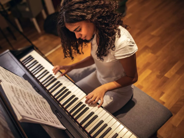 D. Composing a song or playing an instrument