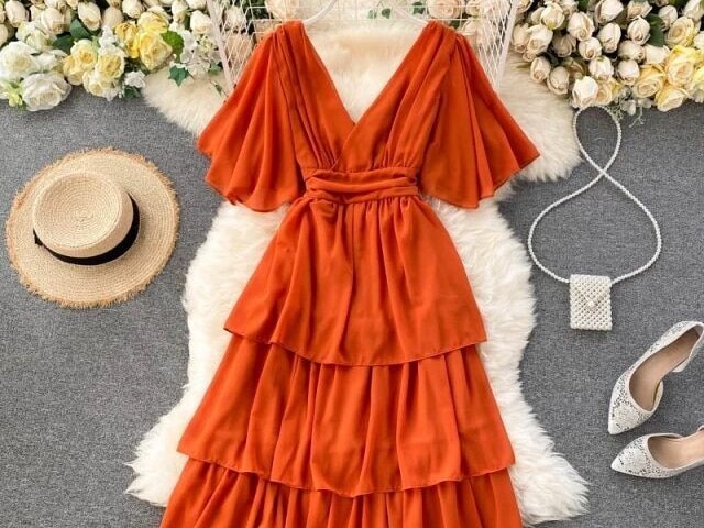 Esse vestido longo laranja lindo