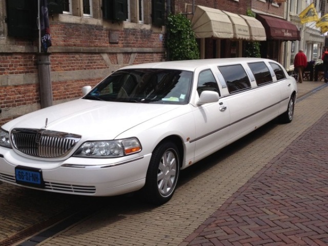 By a limousine